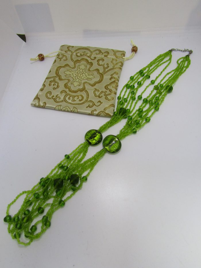 fprest green beads with cream brocade bag